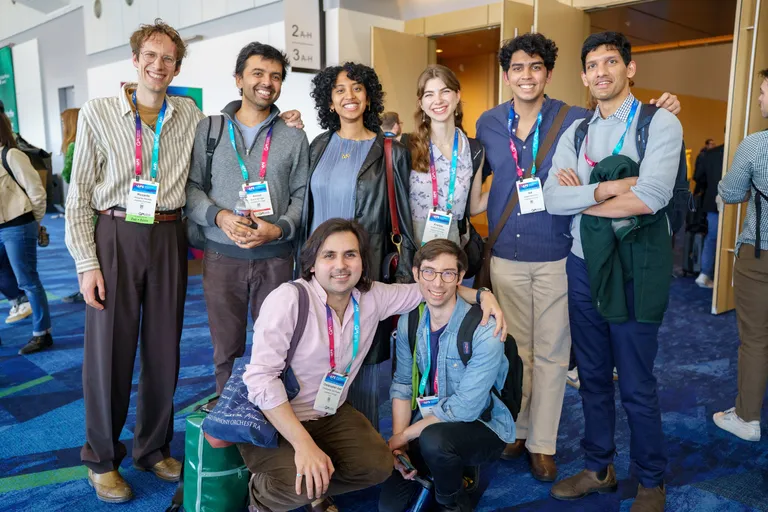 A group of attendees pose for a group photo.